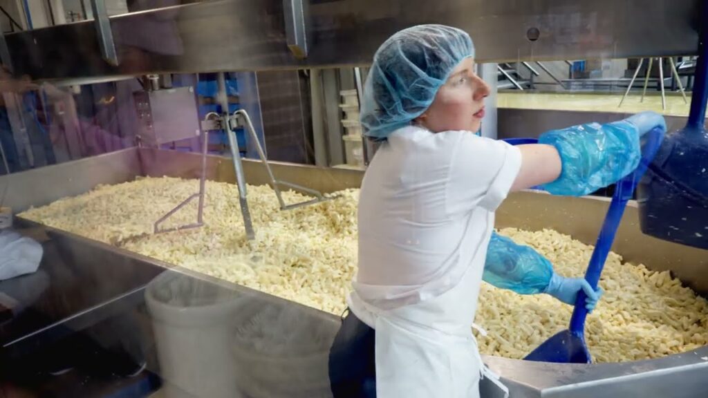 Cheese being made by hand at Beecher's Handmade Cheese, Pike Place Market, Seattle